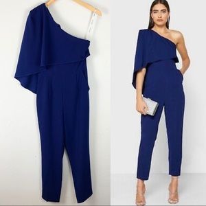 NWT NEW Lavish Alice One Shoulder Cape Sleeve Navy Blue Jump Suit Size 2